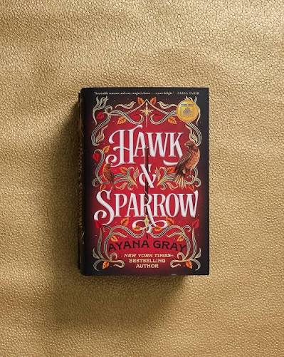 Red background with a reddish-brown hawk perched on the side of the title