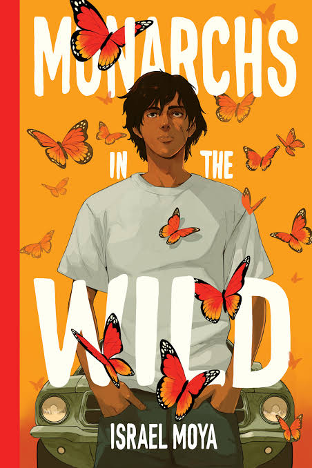 A boy surrounded by monarch butterflies is standing in front of an orange background. The word Monarchs in the Wild are written above and below the boy in white lettering. 