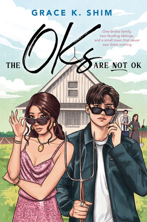 Two teenagers standing in front of a house. The words The OKS are not ok in a small black font are written across the top of the image. 