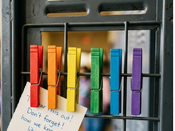 Different colored clothespins inside a locker